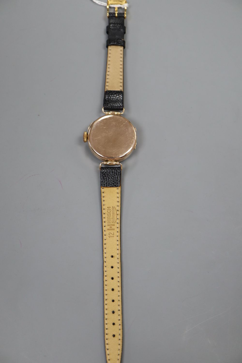 An early 20th century 9ct gold Rolex manual wind wrist watch, with Arabic dial and subsidiary seconds, (dial a.f.)